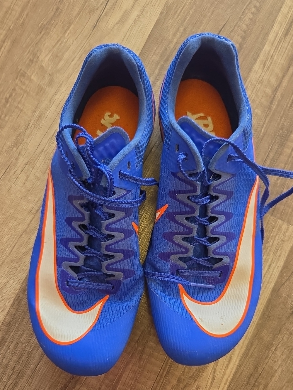 Nike Royal Blue and Orange Cleats with White Swoosh